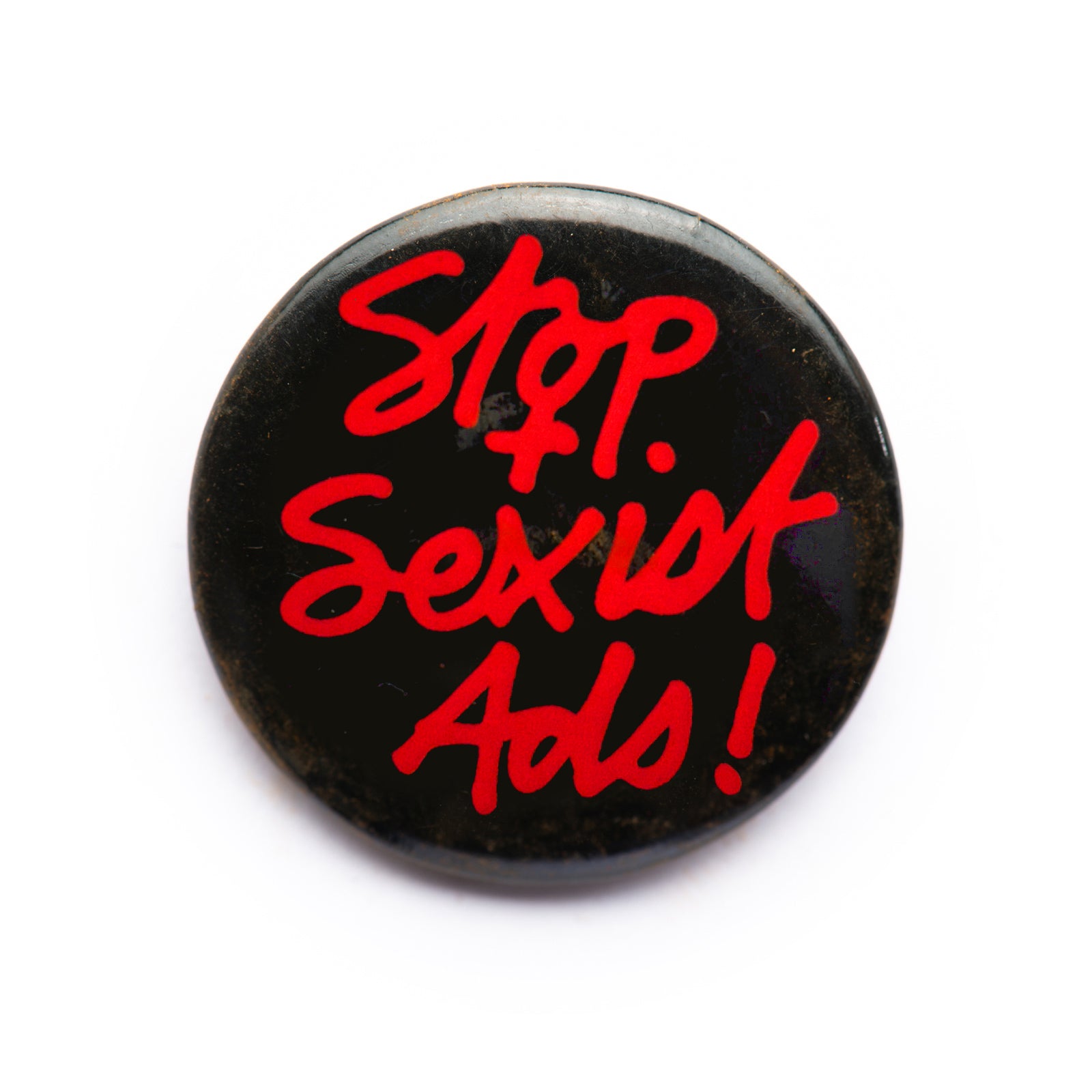 "Stop Sexist Ads!" button pin